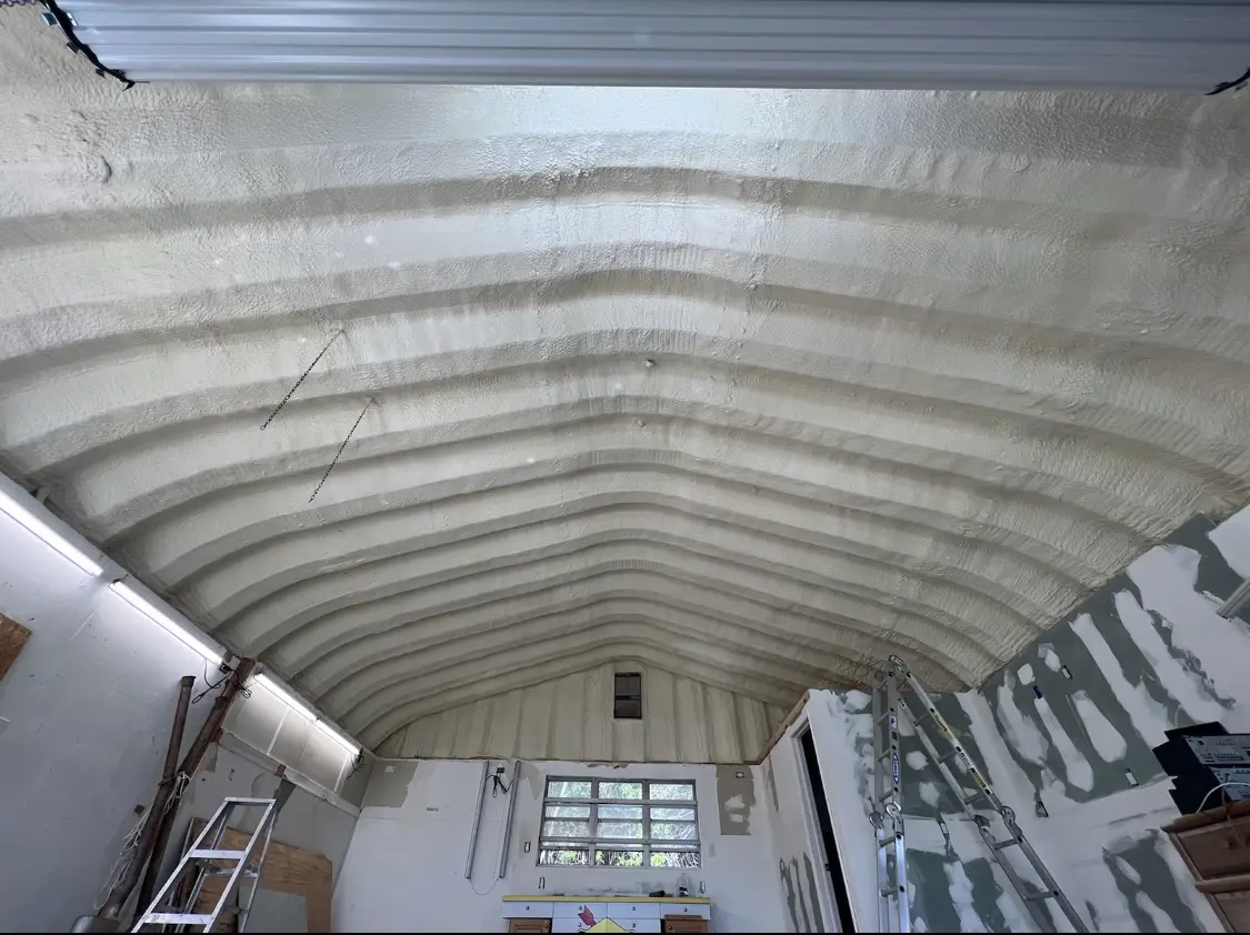 Spray polyurethane foam applied to the underside of a metal roof deck in Oklahoma City
